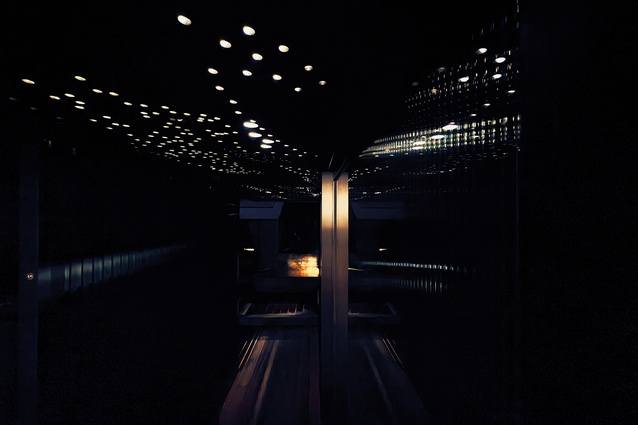 Madalena Refiti’s soffit patterning reflects in the glass sliding doors at night.