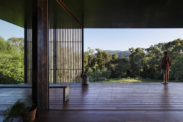 The slatted timber screen opens and extends along the outer edge of the deck. 
