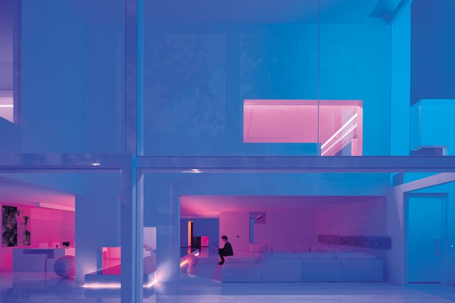 As each day draws to a close, neon LEDs turn the home into a light box of assorted colours.