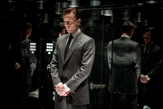 Film still showing Dr Robert Laing (Tom Hiddleston) in the tower block’s mirrored lift.