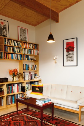 The living space features a built-in bookcase.