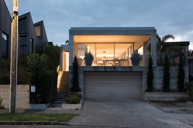 Poured House, Auckland, 2015. The front street elevation features a huge sheltered verandah. 