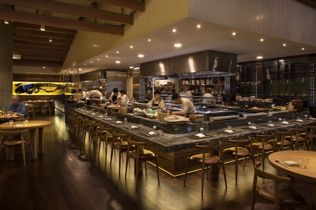 Masu restaurant, open-plan kitchen, natural-edge alpine ash granite counter and calligraphy dragon rice paper wall. 