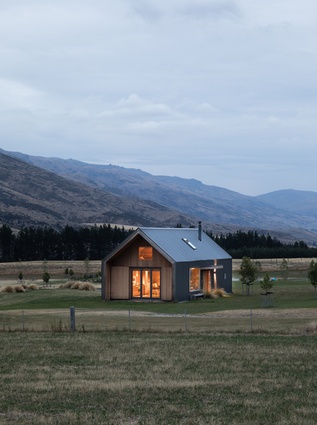 Located on a high country sheep station, the cabin provides a spot from which to appreciate the landscape.
