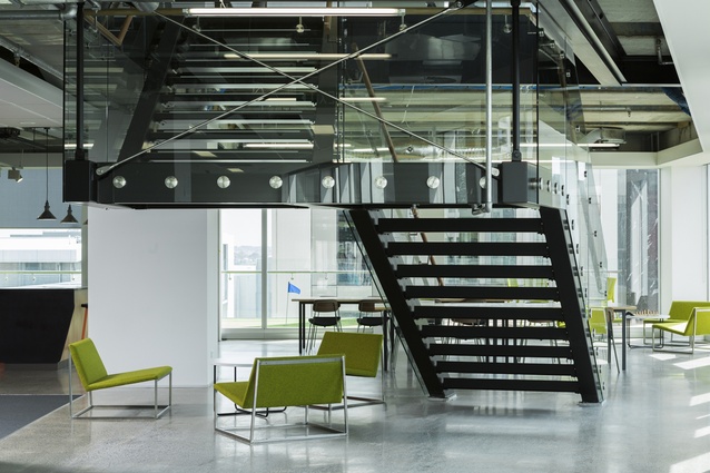 A sleek, modern split-level staircase links the two floors of Spendvision.