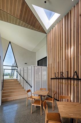 Entry to Urlar features a wall of smooth, fresh tōtara.