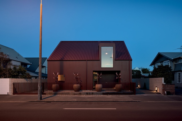 Cedar weatherboards present a traditional profile to the street.