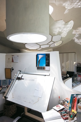 Inverted geodesic skylights provide over-head light to the architect-owner’s study.
