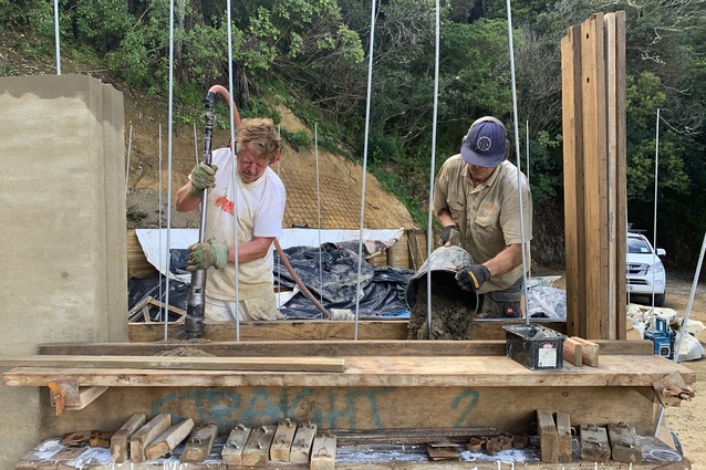 Frank (left) and Paul ramming earth into the forms.