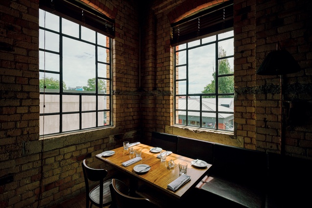 Multi-paned, industrial windows in the 1918 building provide a motif that is repeated throughout the interior design.