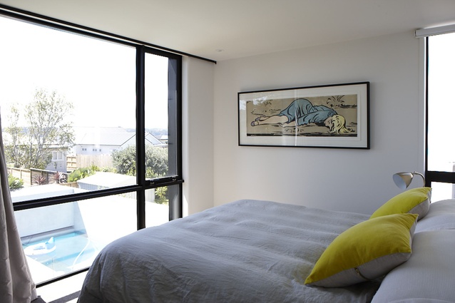 A bedroom overlooking the pool below. 