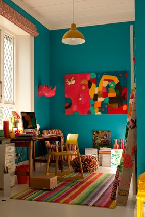 The living room, where teal is the featured hue.