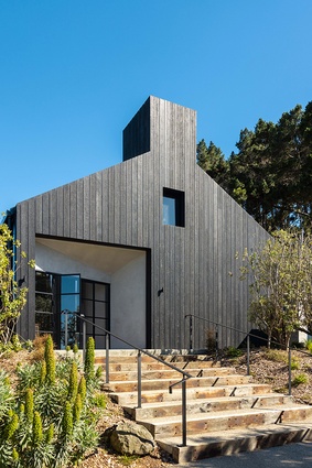 Waiheke Whiskey Distillery & Brewery by Izzard Design — the façade of the building is charred to mimic that of whiskey barrels.