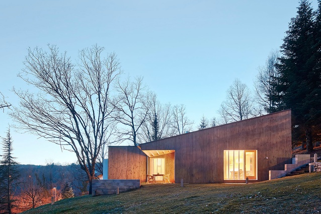 This pine-clad Ripollès cottage, designed by Marc Mogas Architecture, was transported to the site in three modules. Situated near the Pyrenees mountains in Spain, it is a cost-effective summer retreat.