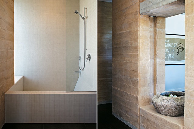 The bathroom conveys the same sense  of solidity as that prevailing in the rest of the house; gaps in the walls connect rooms to one another.