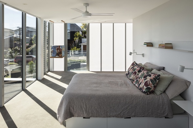 The master suite is wrapped in Danpalon and recessed blinds afford additional privacy when needed.