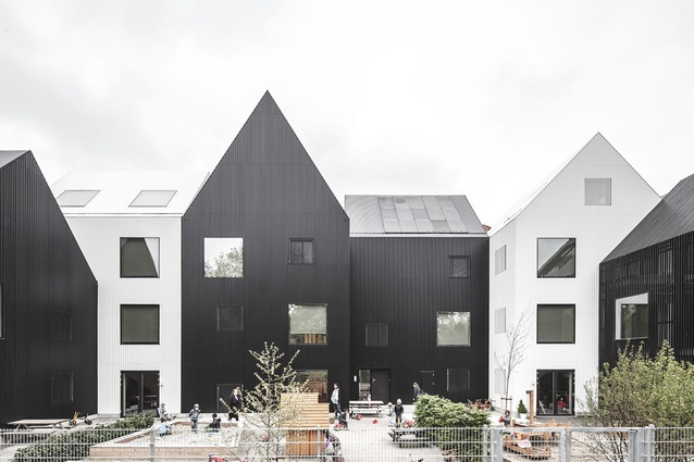 Frederiksvej Kindergarten by COBE, Denmark. The building is divided into 11 houses to create a small-scale village atmosphere, where children can establish their own play niches.