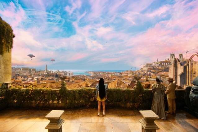 Bella surveying Lisbon from her rooftop. These views reflect her growing recognition and connection with the world.