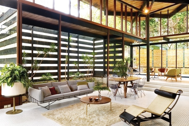 An internal garden, complete with pond, adjoins the dining area and is enclosed with a striped screen similar to the one that encloses the stairwell.