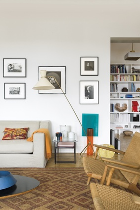 The white floor lamp is by Gino Sarfatti. The sofa is Jetlag by India Mahdavi.