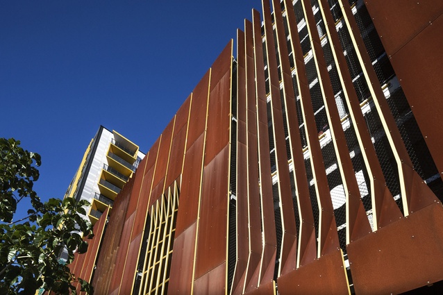 The weathered steel cladding relates to the car-manufacturing industry, with ventilation fins "inspired by a 1969 Monaro".