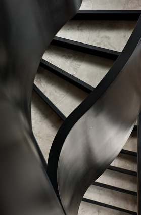 The self-supporting black helix-shaped stair.
