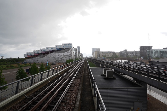 View from Ørestad station, with Mountain Dwellings by Bjarke Ingels Group and JDS Architects (2008) on the left.