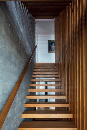 The wooden staircase is the backbone of the home.