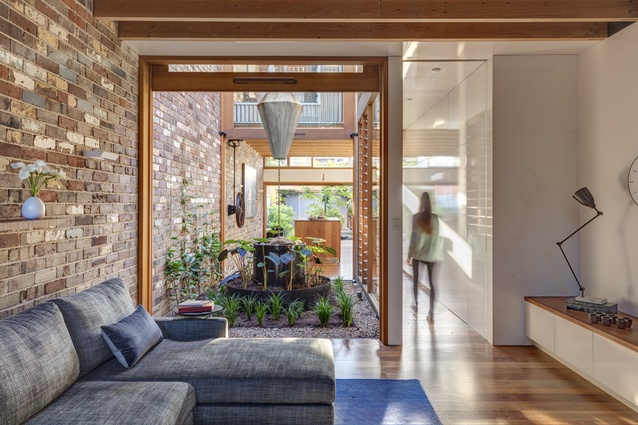 The internal courtyard encourages indoor-outdoor flow in the living space.