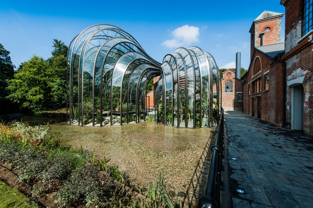 Bombay Sapphire distillery in England by Heatherwick Studio. The two flowing glass forms are functional greenhouses and are heated using warm air that is created during the gin distilling process.