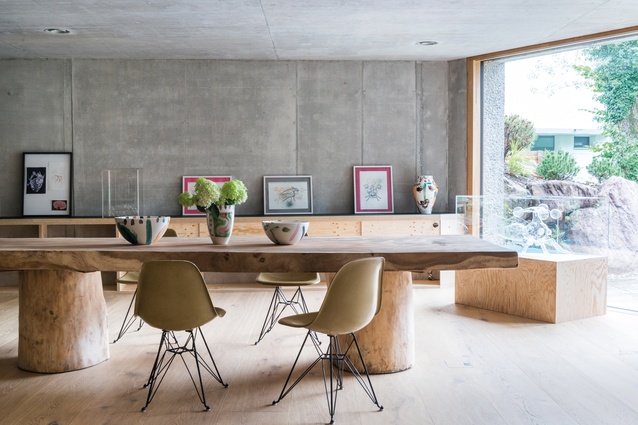 The studio of Melanie Grieder-Swarovski is furnished with a huge wooden table shipped from Ibiza and Eames chairs in pale green. All artworks are by Grieder-Swarovski (aka Melli Ink).
