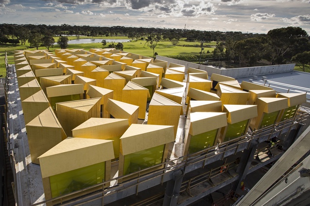 The Australian Islamic Centre by Glenn Murcutt and Elevli Plus Architects features 96 gold painted lanterns which funnel coloured light into the space below.