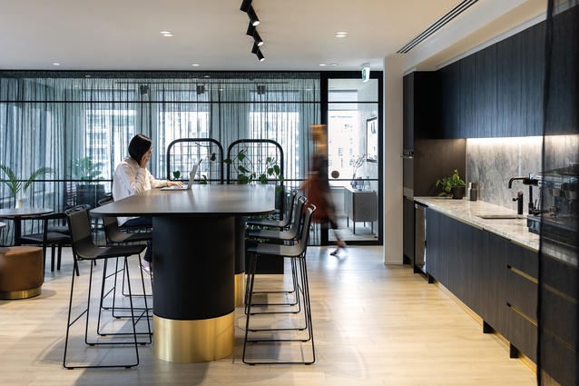 Fisher says, "For Burton’s law firm, we pushed the boundaries of a traditional law firm by having an open reception area with an on-display kitchen..."