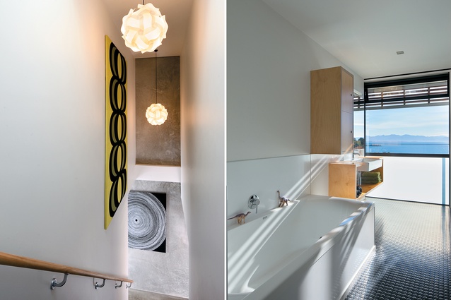 Within the staircase, the exposed concrete contrasts the light plaster walls and bright art; The bathroom features a raw material palette derived from the use of the concrete panels.
