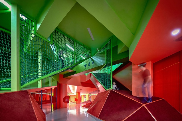 Soyoo Joyful Growth Center. Five tubes of different colours cut through the building in different angles, opening up to a multitude of journeys that children can choose from.