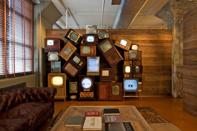 A stack of vintage televisions distinguishes the reception area of Media Storm.