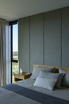 Built-in timber features such as room dividers, storage cabinets and, in the bedrooms, headboards and bedside tables, hark back to the modernist mood favoured by the client.
