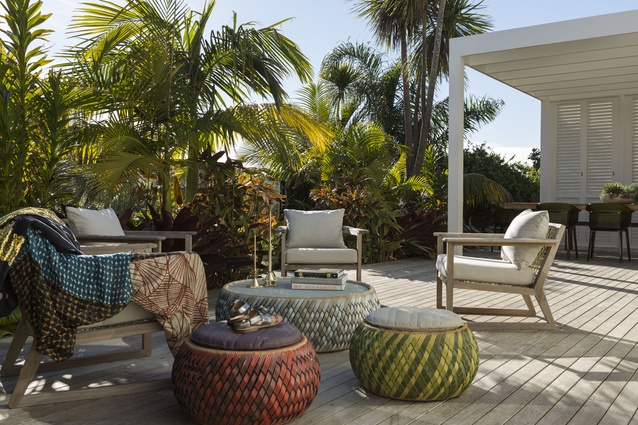 Outdoor ottomans from Domo and throws from Citta design brighten an outdoor area. 