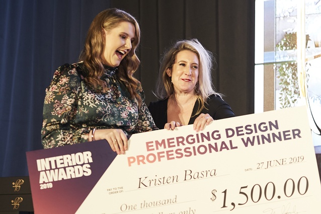 Kristen Basra (left) receiving her $1500 prize after winning the Emerging Design Professional category at the 2019 Interior Awards.