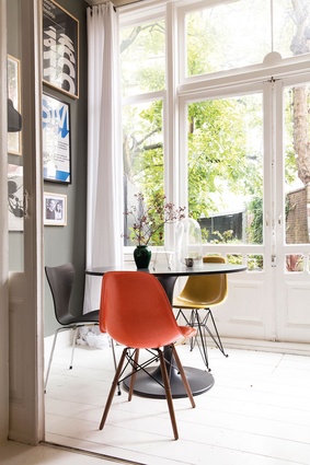The chairs in the sunroom are by Eames and Arne Jacobsen.
