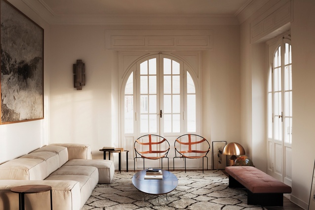 Lounge with Flavio de Carvalho’s leather chairs, a Berber carpet, Living Divani sofa, furnishings and art that complement the classic architecture.