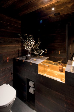 The bathrooms feature brass washbasins and handpainted tiles. 
