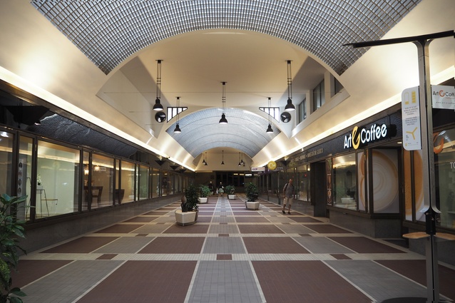 A Functionalist passageway with an arched ceiling of glazed bricks.