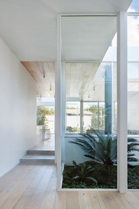 Floor-to-ceiling glass walls provide constant access to the changing conditions of the sky.