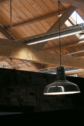 Details from the fit-out – ceiling joinery and industrial-style  lighting.