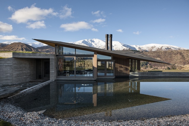 The palette of this home includes polished and board-formed concrete, stone, glass and water.
