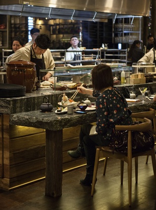 Robata customer bar counter, with intimate view of chefs working. 