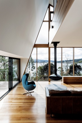 The north-facing living room enjoys a lofty double-height space created by the new addition.