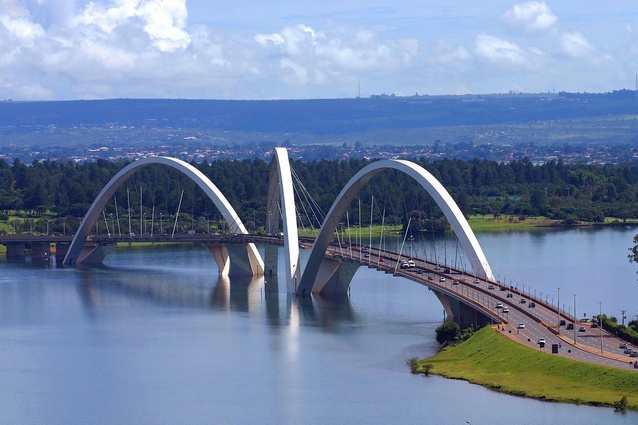 Brazil's Juscelino Kubitschek bridge was completed in 2002 and designed by Alexandre Chan. Three steel arches jump from side to side to support the deck of the 1188m-long bridge.