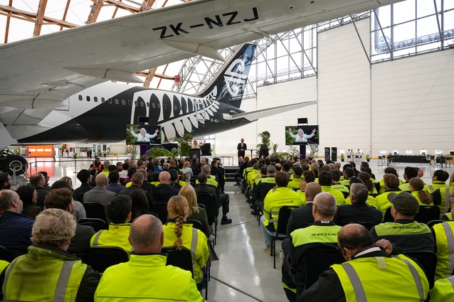 Hangar 4 opening ceremony. Attendees gathered beneath the wingspan of a Boeing 787-9 Dreamliner.
